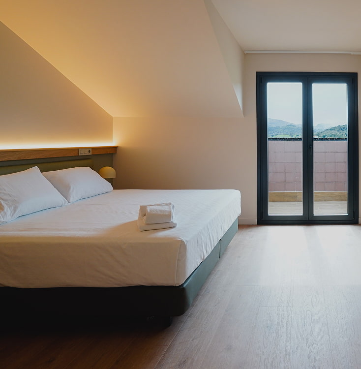 Superior triple room with King size bed and balcony with mountain views